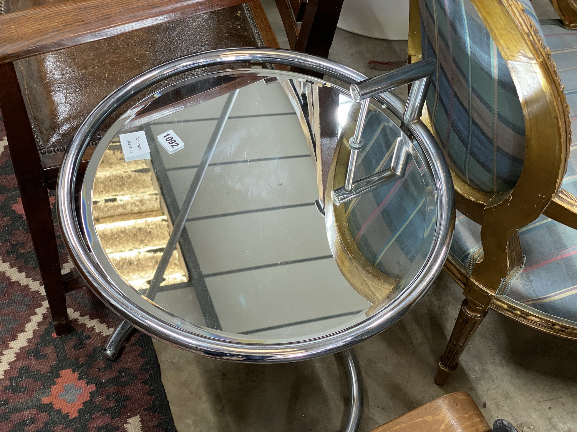 An Eileen Gray style circular chrome and plate glass telescopic coffee table, diameter 48cm